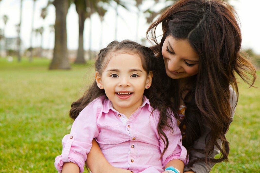 mom-and-daughter-sitting-outside